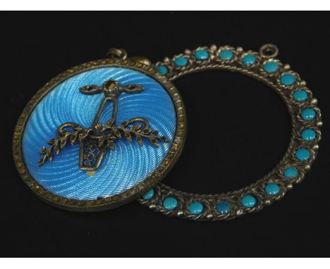 Two items of costume jewellery, to include a turquoise set pendant, white metal stamped 925, and an enamel basket pendant, si