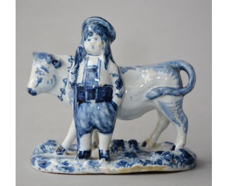 A little blue decorated Dutch delftware statue, marked APK (De Grieksche A), H 12,5 - W 13,5 cm