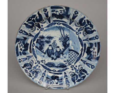 A rare 18thC Dutch Delftware Wanli plate, blue and white decorated, Diameter 34 cm (chip and the usual negligible glaze flaki