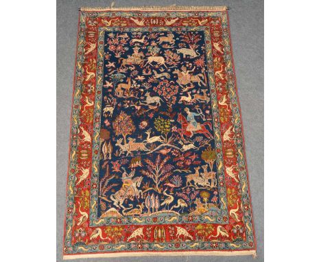 An Oriental rug, decorated with a hunting scene, wool on cotton, 137 x 209 cm 