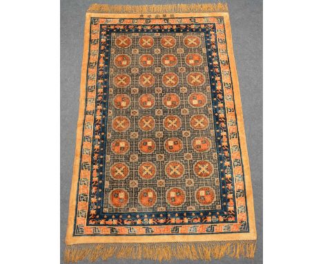 A Chinese carpet, silk on cotton with gold thread, signed, 190 x 293 cm