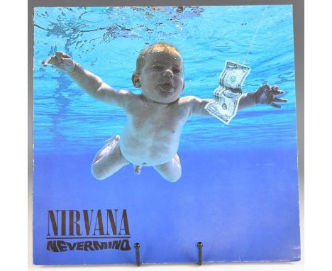 Nirvana - Nevermind first press with inverted Monkey and text on inner sleeve, with embossed clef symbol on B side label. Vin