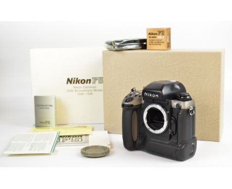 Nikon F5 50th anniversary 35mm SLR camera body, serial number 3119517, in original box with strap, DK-2 rubber eyecup, instru