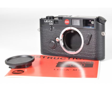 Leica M6 35mm rangefinder camera black body, serial number 1657743, circa 1984, with instruction manual, in original box with