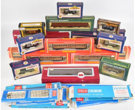 Eighteen Hornby, Bachman, Dapol and Mainline 00 gauge model railway passenger carriages and goods wagons together with a coll