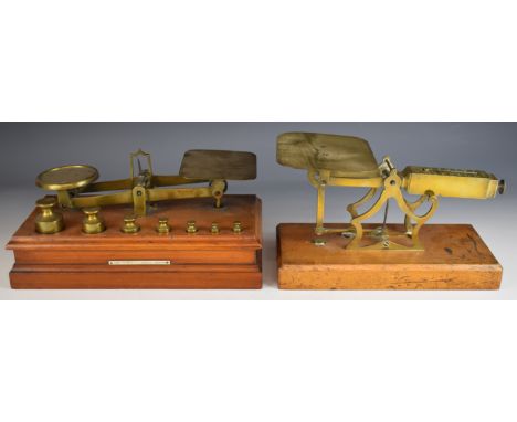 Two sets of late 19th or early 20th century postage scales or balances, one with plinth base set with ivorine plaque for Eden