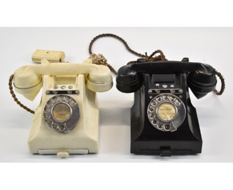 Two vintage Bakelite telephones comprising one black and one white model 328F
