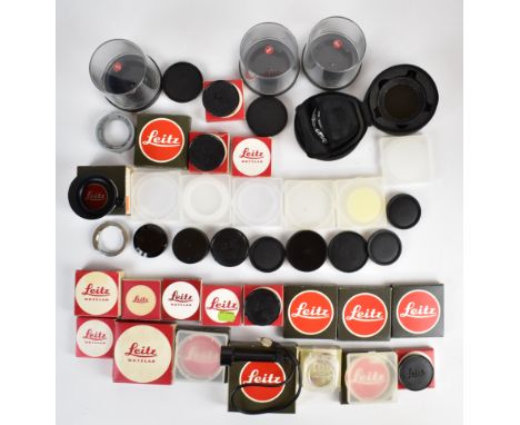 Leica camera accessories comprising 13356 and 13352 polarising filters, four 14056 body caps in original boxes, M2 28-35 M3 1