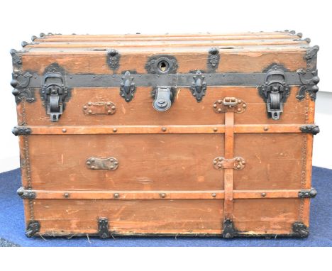 19th / 20thC ash and metal bound travelling trunk with interior label 'Travelers Casualty Co, Broadway New York', W110 x D60 