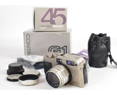 Contax G1 35mm film camera, serial number 105004, with Zeiss Planar 2/45 T* lens, P filter, body cap, lens caps, lens pouch, 