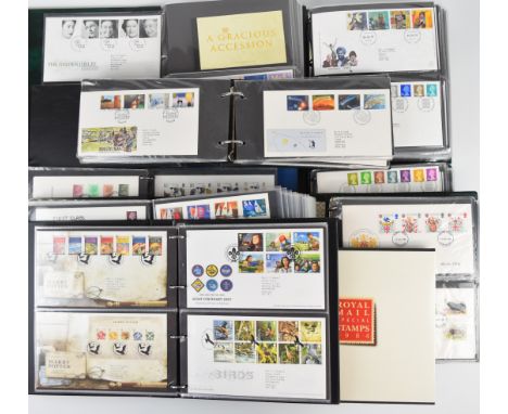 A collection of GB first day covers and prestige booklets in eight folders and the 1984 year book