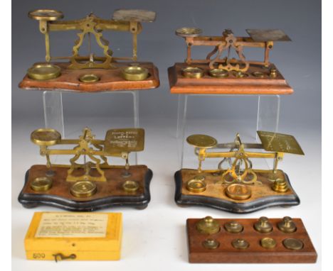 Four sets of late 19th or early 20th century postage scales or balances including Mordan and John Heath, two having ivorine p