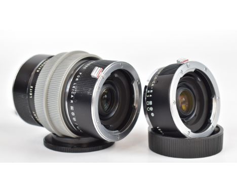 Three Leitz extender-R 2x, two to suit Leica R cameras, the other to suit R3 and R4, with caps and holder