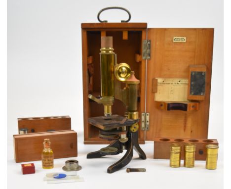 E.Leitz Wetzlar 19th century brass microscope, serial number 49235, in original wooden case with extra lenses in slide out ra