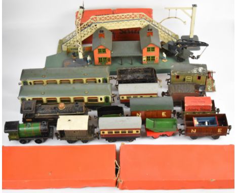 Three Hornby and Marklin 0 gauge clockwork model railway locomotives together with a collection of wagons, carriages and acce