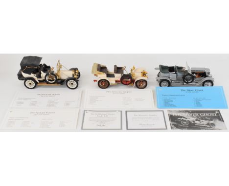 Three Franklin Mint 1:24 scale diecast model veteran cars comprising Mercedes Simplex, 1912 Packard Victoria Model 1-48 and 1