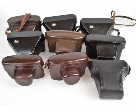 Nine leather Leica camera cases, comprising four tan and five black examples
