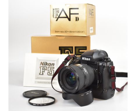 Nikon F5 35mm SLR camera, serial number 3034111, with Nikkor AF 20-35mm 1:2.8 D lens, serial number 237999, with HB-8 hood, L