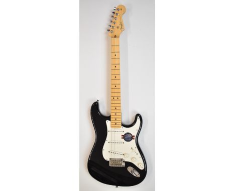 Fender Stratocaster electric guitar in black finish, 2009, serial Z9427358, with Fender branded flight case and accessories, 