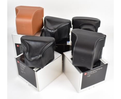 Five boxed Leica camera cases comprising 14889, 14856, 14891 and two 14872 examples