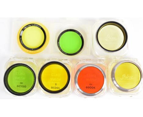 Seven Leitz E36 and E34 camera lens filters comprising E36 orange, green, 0, 1 and 2, all in original plastic cases, together