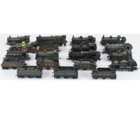 Twelve 00 gauge model railway locomotives together with a group of tenders.