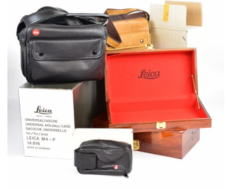 Leica camera cases comprising 14816 holdall, leather outfit case in 14852 box, 14840 combination case, 18501 ever ready case 