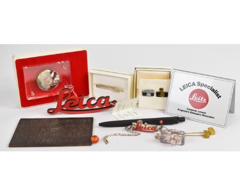 Leica promotional items comprising silver 1979 commemorative medallion in Perspex slab and original case, bronze commemorativ