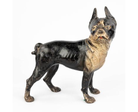 An antique figurative door stopper in the shape of a dog. Made of cast iron with original polychrome. The first half of the 2