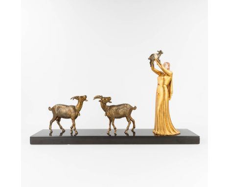 Lady with 3 goats, a statue made in art deco style. Spelter and marble, the first half of the 20th century.  Dimensions: (L:1