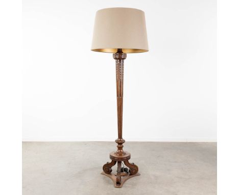 A wood sculptured standing lamp, circa 1920. Dimensions: (L:42 x W:42 x H:188 cm)