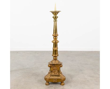 A large candlestick made of copper decorated with angels.  Dimensions: (H:96 cm)