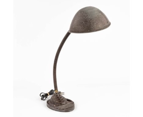 A table lamp made of metal in Bauhaus style. Circa 1940.  Dimensions: (H:42 cm)