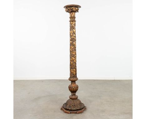 An antique wood sculptured stand or candlestick, decorated with grape vines. Made of wood an stucco.  Dimensions: (H:152 cm)