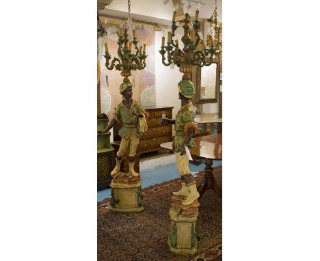 BLACKAMOOR TORCHERES, a pair, 18th century style, polychrome resin each figure with nine light candelabra above, 220cm H.  (2
