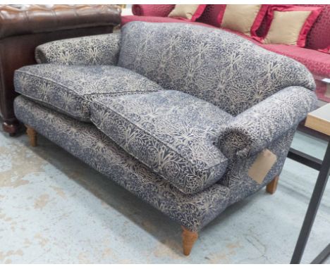 RECLINE & SPRAWL SOFA, two seater, floral pattern on a blue ground, 140cm L.