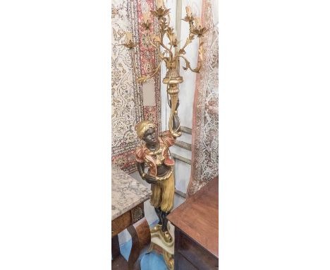 BLACKAMOOR, polychrome and gilt, holding a candelabra aloft, on a triform base, 190cm H. (with faults)
