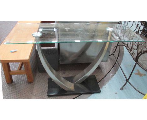 CONTEMPORARY CONSOLE TABLE, with glass bevelled top, on chromed metal curved supports on black base, 122cm x 46cm x 76cm H.