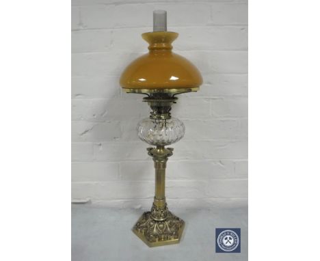 A good Victorian brass King &amp; Brown oil lamp with glass chimney and tan shade, with clear glass reservoir