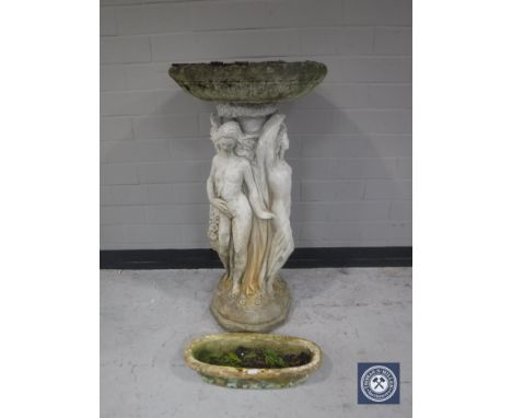A concrete garden bird bath and small trough 