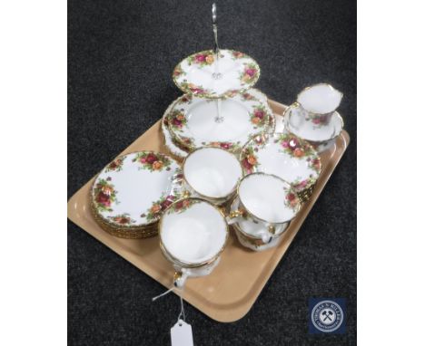 A tray containing a twenty-two piece Royal Albert Old Country Roses part tea service