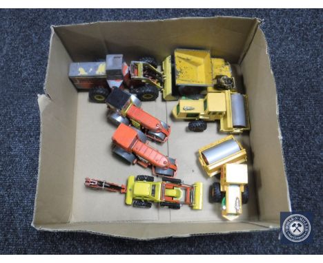 A box containing eight 20th century Dinky and Corgi toys die cast farm vehicles