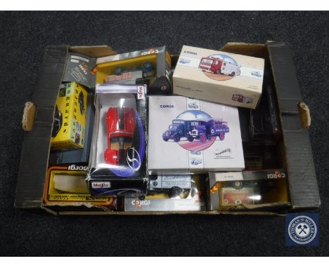 A box of a quantity of boxed die cast vehicles including Corgi, Maisto, Vanguards etc 