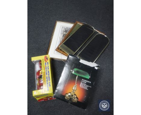 A boxed banker's desk lamp together with a brass framed three-way folding spark guard, two framed prints and a remote control