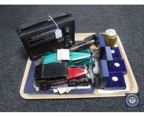 A tray containing a Binatone Europa radio, two die cast classic cars, Esso football coin collection, three boxed Halcyon Days