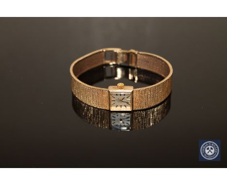 A lady's 9ct gold Omega wrist watch, 27.5g.