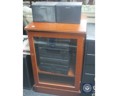 A mahogany hi/fi cabinet containing JVC hi/fi and a speaker of Sony speakers  