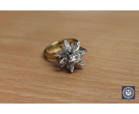 An 18ct gold diamond set ring, the principal stone weighing an estimated 0.3 carat, 7.4g CONDITION REPORT: In good condition 