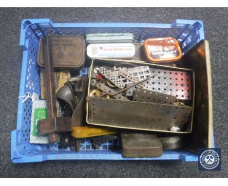 A basket of two vintage woodworking planes, vintage tins, Meccano etc