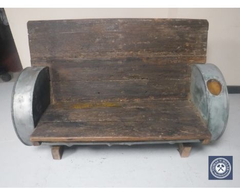 A bespoke oil drum and wood garden bench 